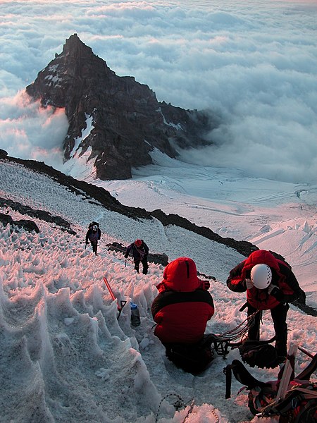 Climbers ascending Mount Rainier looking at Little Tahoma Peak