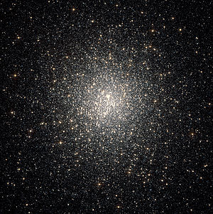 Thousands of white-ish dots scattered on a black background, strongly concentrated towards the centre