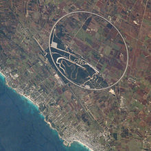 Photograph from space of Nardo Ring in Italy, it is 12.6 kilometres (7.8 mi) long and is perfectly round - the image was taken from the ISS at an angle making it appear elliptical. Nardo ring.jpg