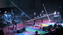 New Order performing in Chile in 2019 New Order, Chile 2019 (39751785423).jpg