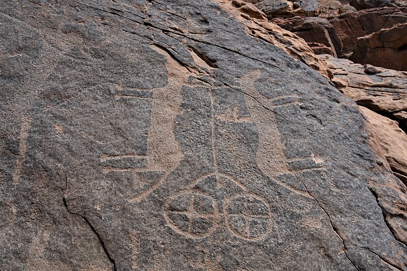 File:Petroglyph of wheeled vart pulled by two horses, ca. 1500 BCE, Jubbah rock art site, Saudi Arabia.jpg