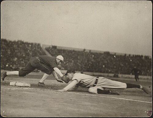 Pickoff attempt during one of the games.  Frank Chance slides in safely past the tag of Jiggs Donahue.