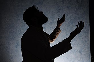 Raising hands in Dua Prayer at night.jpg