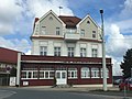 Tourist home;  Inn with a wooden veranda in front