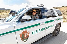 A NPS law enforcement ranger in a Chevrolet Tahoe patrol vehicle. Ranger Stang in his patrol vehicle (48015902018).jpg