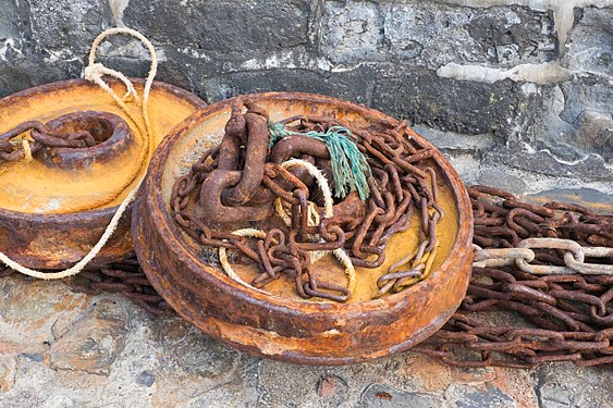 Rusty fishing weights and chains, Lyme Regis, England
