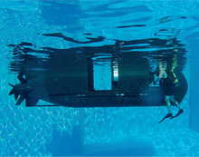 The prototype Shallow Water Combat Submersible (SWCS) being tested in a pool SWCS pool testing.png