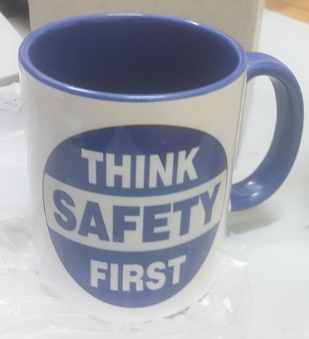 A mug reminds the drinker to be careful.