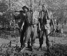 The Frederick Hart bronze statue Three Soldiers at the Vietnam Veterans Memorial in Washington D.C. Statue Three Servicemen Vietnam Veterans Memorial-editA.png