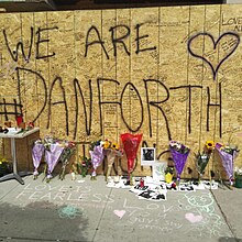 People of Toronto left floral tributes for 18-year-old Reese Fallon with the message "We are #Danforth" The restaurant involved in 2018 Danforth Shooting.jpg