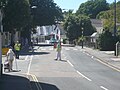 Traffic directos, in Trinity Road, Ventnor, Isle of Wight, directing traffic away from the town centre. The Island Games 2011 town cycling event was occuring at the time, which ran in a loop around the town centre, meaning it was completely closed off to traffic.