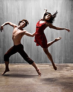 Two dancers leaping