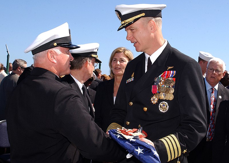 File:US Navy 070323-N-8544C-160 Command Master Chief Charles L. Dassance presents the ensign to USS John F. Kennedy (CV 67) Commanding Officer Capt. Todd A. Zecchin during the historical decommissioning ceremony of the aircraft carr.jpg