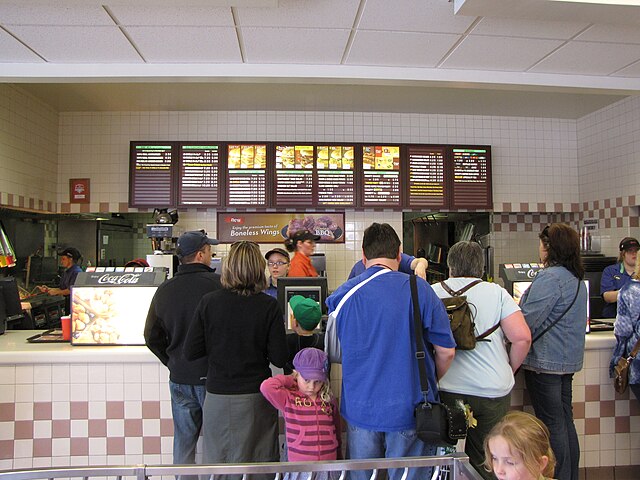 A busy front counter at a Wendy's restaurant in Niagara Falls, Ontario