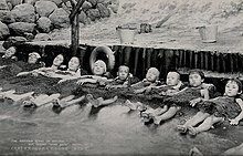 Women and children take a hot sand bath at a hot spring in Beppu Women and children take a sand bath at a hot spring, Japan Wellcome V0049853.jpg