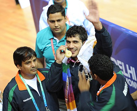 XIX Commonwealth Games-2010 Delhi 74kg Greco-Roman style wrestling Sanjay Kumar of India (Gold), showing his medal, in New Delhi on October 05, 2010.jpg