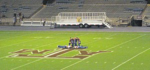 Junior Yell Leaders perform pushups and the Aggie Band plays a tune. Junior Yell Leaders are required to do a "class set", which is 100 push-ups plus their class year. (i.e. 2012 would be 112) Yell Leaders doing pushups.JPG