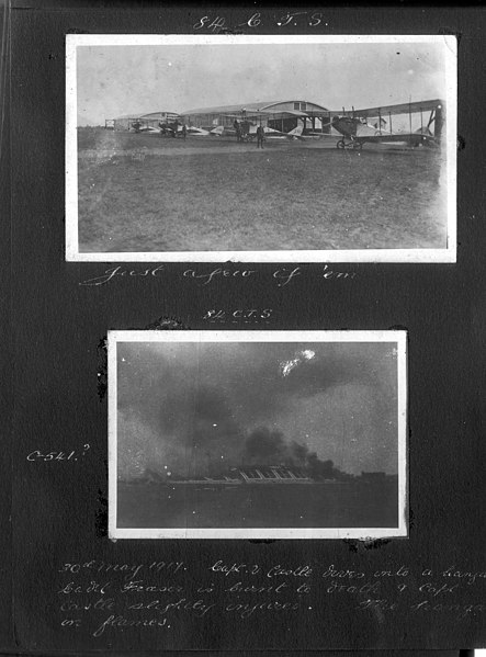 File:"84 C.T.S. Just a few of them" four aircraft lined up outside two hangars. (3328547969).jpg