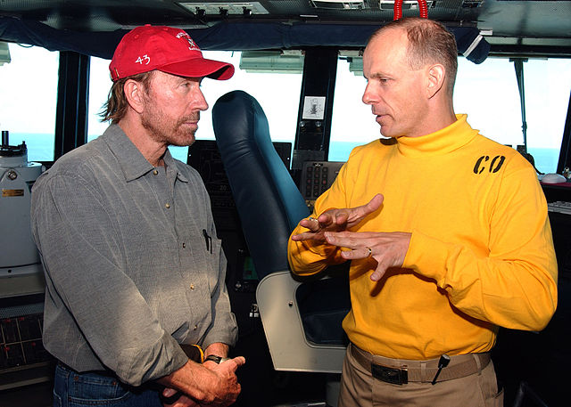 Norris during a meeting with USS Theodore Roosevelt (CVN-71) commanding officer Captain J. R. Haley, in June 2005