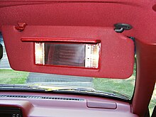 Passenger's sun visor in down position with a lighted vanity mirror in a 1993 Jeep Grand Cherokee 1993 Jeep Grand Cherokee Laredo - Blackberry with Crimson interior 12.jpg