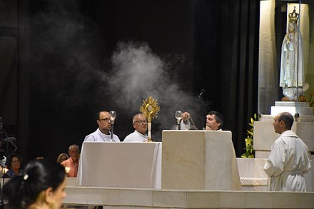 Eucharistic adoration in the Chapel of the Apparitions of the Sanctuary of Our Lady of Fátima in Portugal.