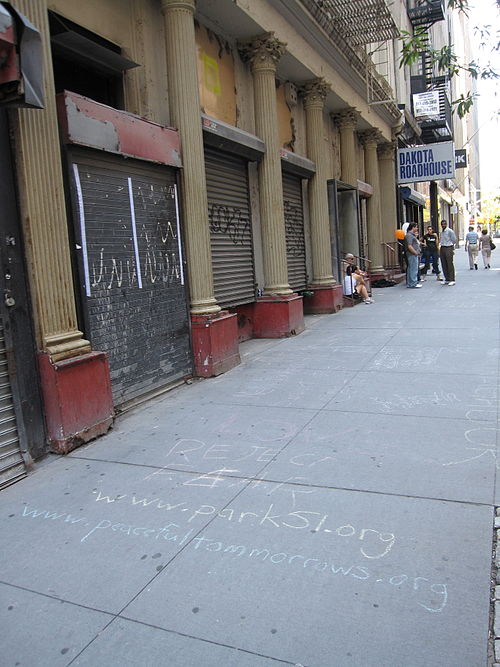 Slogans drawn by supporters on the pavement in front of the former Burlington Coat Factory, in 2010