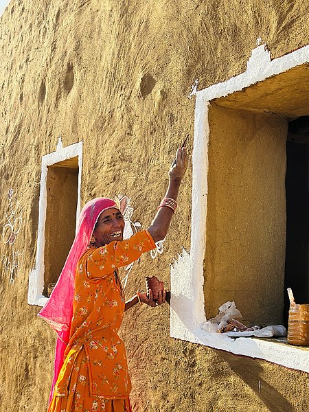 File:A Rajasthani lady decorating house.jpg