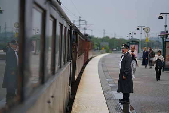 File:A heritage train conductor, Täby centrum