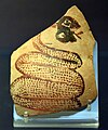 Shard of pottery decorated with a snake sticking out its tongue. Tell Arpachiyah, Iraq. Halaf period (6000–5000 BC). British Museum.