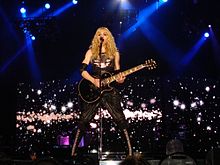 Madonna performing "Ray of Light" during the 2008 Sticky & Sweet Tour. The song won an MTV Video Music Award for Video of the Year and a Grammy Award for Best Dance Recording. Adi Madonna Houston.jpg