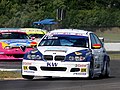 Alessandro Zanardi - BMW 320i at The Esses at the 2004 ETCC rnds 11-12 at Donington (50898337541).jpg