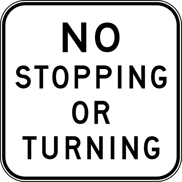 Turned r. No stopping sign.