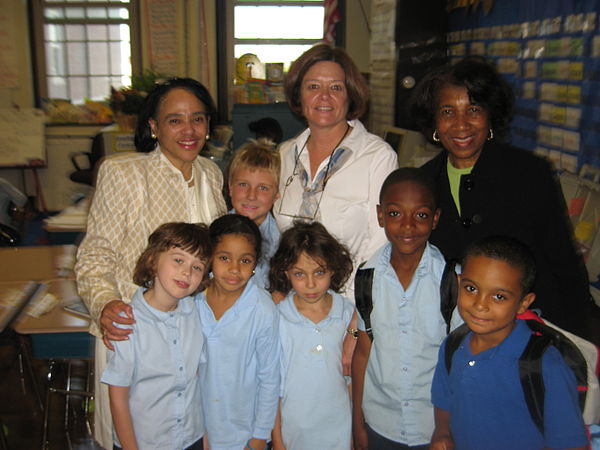 Dr. Carol R. Johnson (back row, far left), former Superintendent of the Boston Public Schools, meets students and their teacher Mrs. McClain and princ