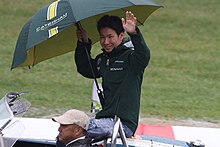 Kamui Kobayashi (pictured here in 2014) scored pole position with teammate Mike Conway Caterham, No.10 Kamui Kobayashi (2) (15531214278).jpg