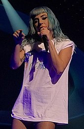 Grande collaborated with Lady Gaga on the song "Rain on Me" from Gaga's sixth studio album Chromatica. Enigma+Jazz (49411690728) (cropped).jpg