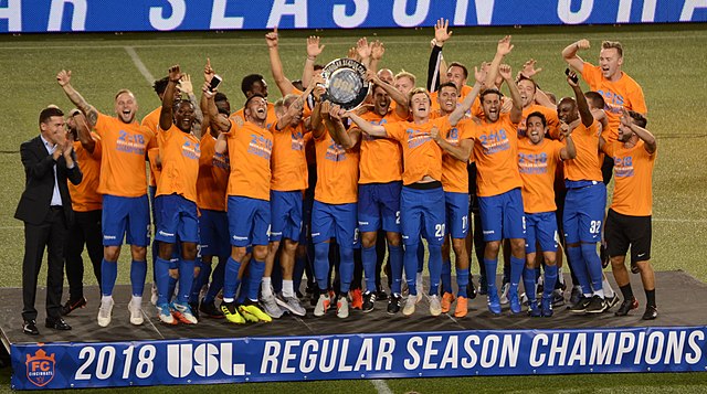 The players and staff celebrate clinching the 2018 USL regular season title.