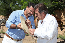 Camiroaga (left) with former President of Chile Eduardo Frei Ruiz-Tagle, which he supported in the 2009–2010 elections, during an interview for his talk show Animal Nocturno.