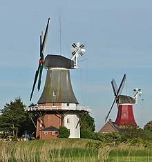 Two smock mills with a stage in Greetsiel, Germany Greetsieler Zwillingsmuhlen 2010.jpg