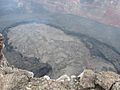 English: Looking northwest at the lava pond on the floor of Pu`u `Ō `ō crater. At the time of the photograph, the level of the lava pond was about 3 m (10 ft) below the floor of the crater