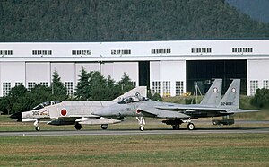 A Mitsubishi F-4EJ Kai Phantom of the Air Development and Test Wing and a Mitsubishi F-15J of the 305th Tactical Fighter Squadron at Gifu Air Field.