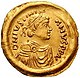 Золота монета треміс, на якій зображений Юстиніан. Приблизно 527–565 рр.