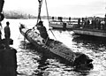 Image 27A Japanese Ko-hyoteki-class midget submarine, believed to be Midget No. 14, is raised from Sydney Harbour (from History of the Royal Australian Navy)