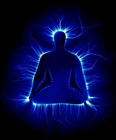 A Kirlian photo showing an artistic representation of a man in the Lotus position, surrounded by a blue glow