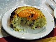 Knish, a baked snack, commonly filled with potato Lower East Side - Schimmel Knish 2.jpg