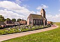 Zicht op de Mariakerk van Wierum vanaf de zeedijk.