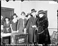 Mr. and Mrs. Arthur Lueder voting at the front of a line in a room.jpg