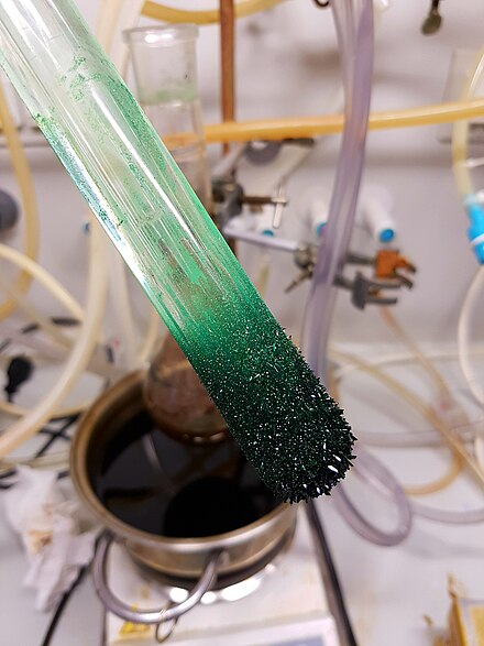 Dark green crystals of nickelocene, sublimed and freshly deposited on a cold finger