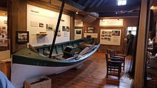 Exhibits at the museum include a typical Norwegian-style fishing boat North Shore Commercial Fishing Museum interior 1.jpg