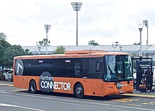 Volvo B7R Northern Connector bus at Hamilton Transport Centre - transferred to Pavlovich fleet in 2009. Seddon Park floodlights are in the background. Northern Connector EQC323 20161029.jpg