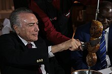 On March 19, 2017, President Michel Temer dined at a steakhouse with ministers and ambassadors in an attempt to mitigate the effects of Operation Carne Fraca. Presidente Temer convida embaixadores para churrascaria (33498133966).jpg